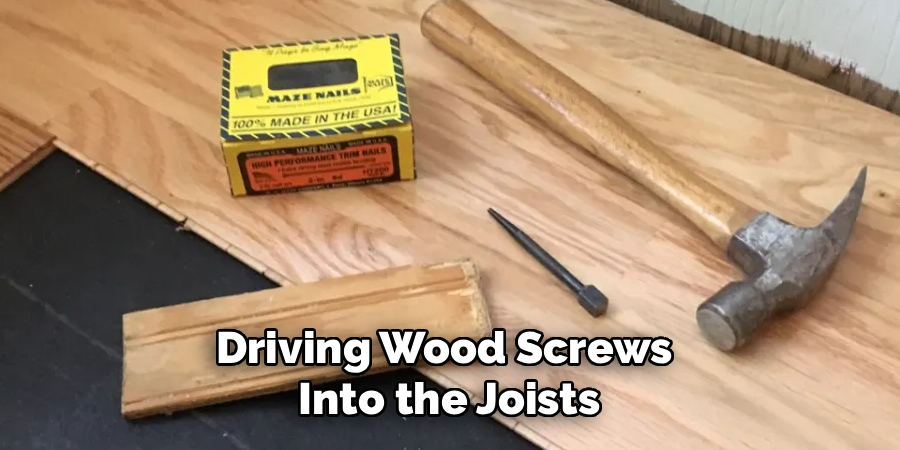 Driving Wood Screws 
Into the Joists