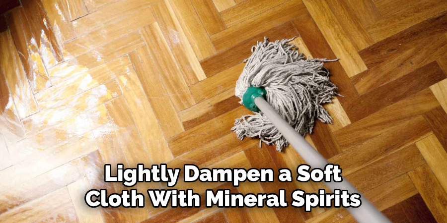 Lightly Dampen a Soft
Cloth With Mineral Spirits