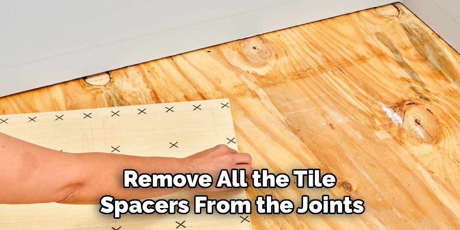 Remove All the Tile 
Spacers From the Joints