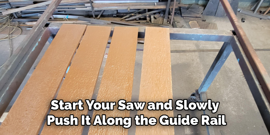 Start Your Saw and Slowly Push It Along the Guide Rail