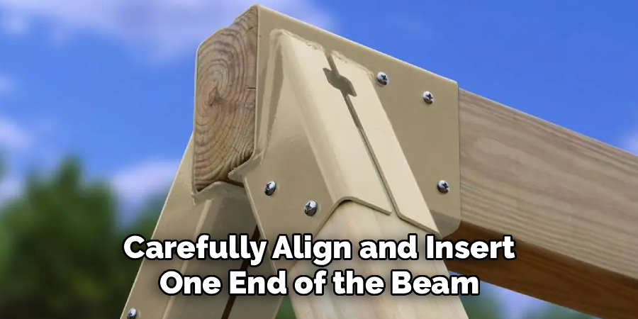 Carefully Align and Insert 
One End of the Beam 
