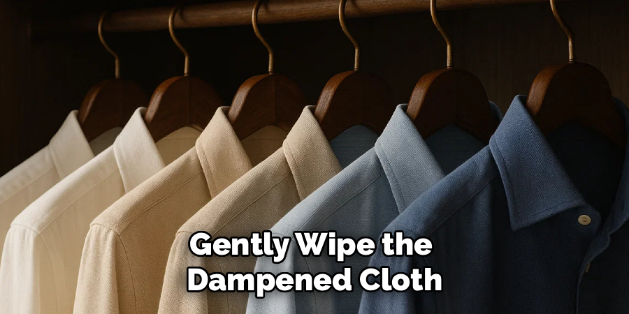 Gently Wipe the
Dampened Cloth